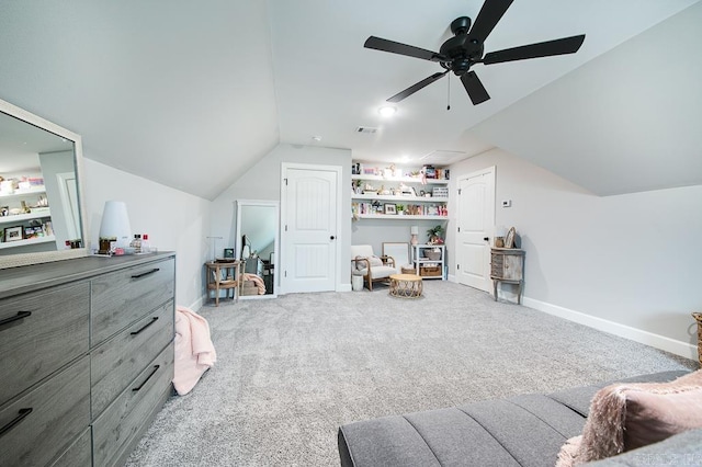 interior space with carpet flooring, ceiling fan, and vaulted ceiling