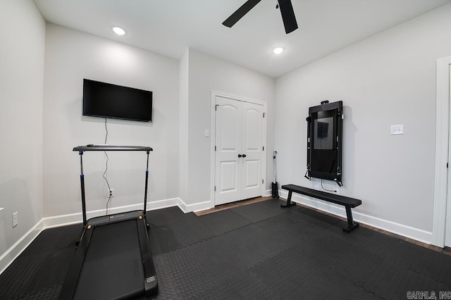 exercise room featuring dark hardwood / wood-style floors and ceiling fan