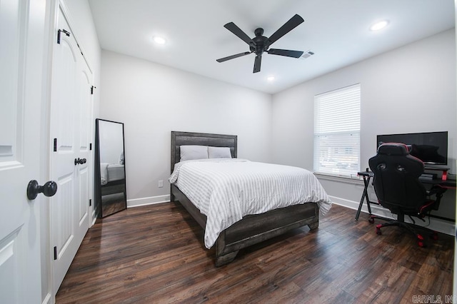 bedroom featuring dark hardwood / wood-style floors and ceiling fan