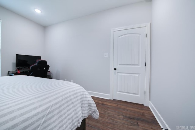 bedroom featuring dark hardwood / wood-style flooring