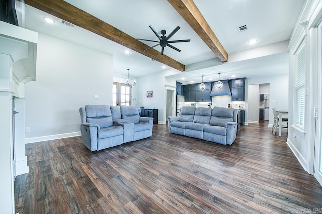 living room featuring beamed ceiling, dark hardwood / wood-style floors, and ceiling fan