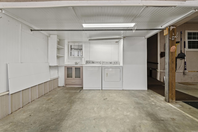 basement featuring washing machine and clothes dryer