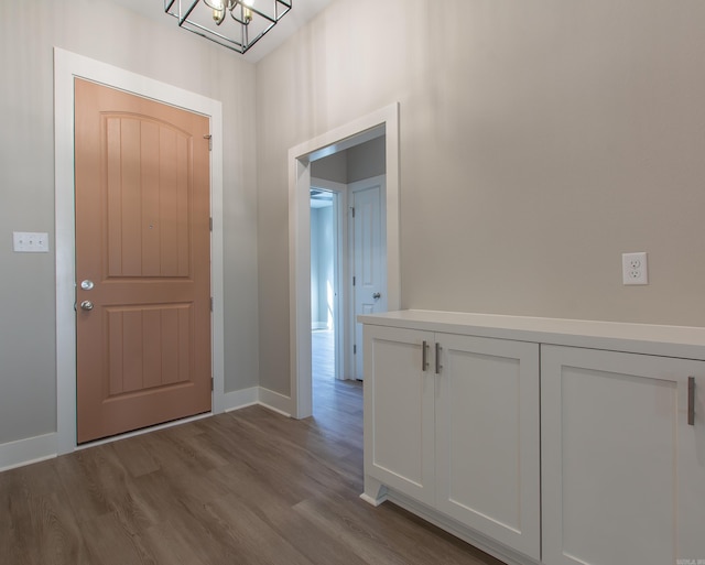 entrance foyer featuring light hardwood / wood-style flooring and an inviting chandelier