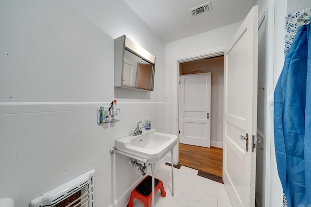 bathroom with wood-type flooring