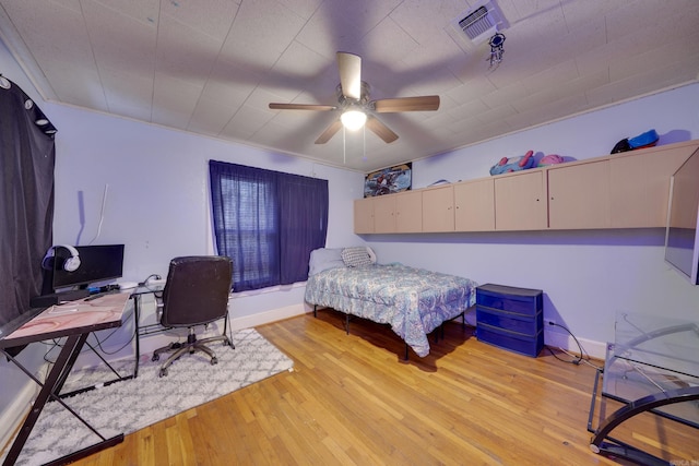 bedroom featuring ceiling fan and light hardwood / wood-style flooring