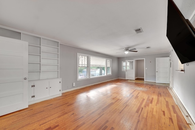 unfurnished living room featuring ceiling fan and light wood-type flooring
