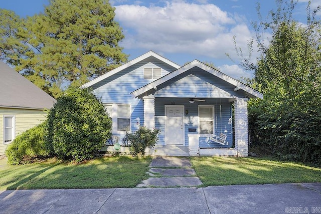 bungalow-style home featuring a front yard and a porch