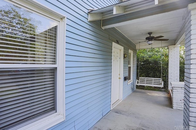 view of patio featuring ceiling fan