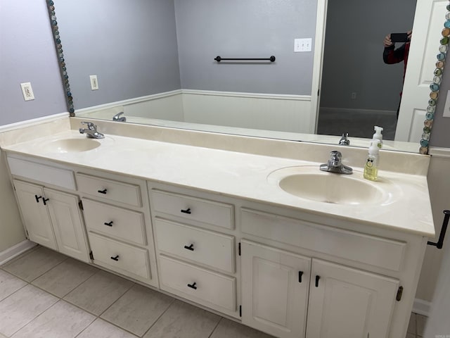 bathroom with vanity and tile patterned floors