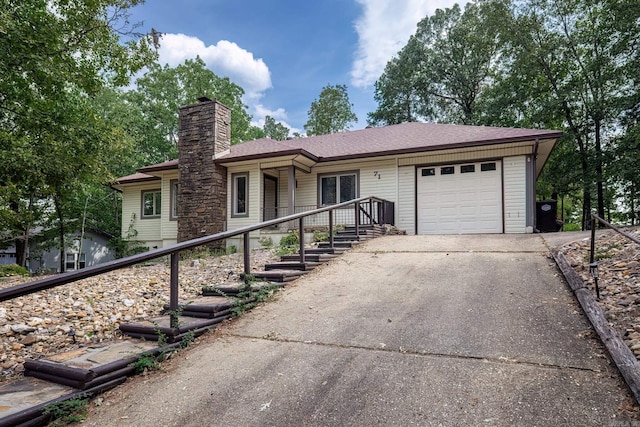 ranch-style house with a porch and a garage