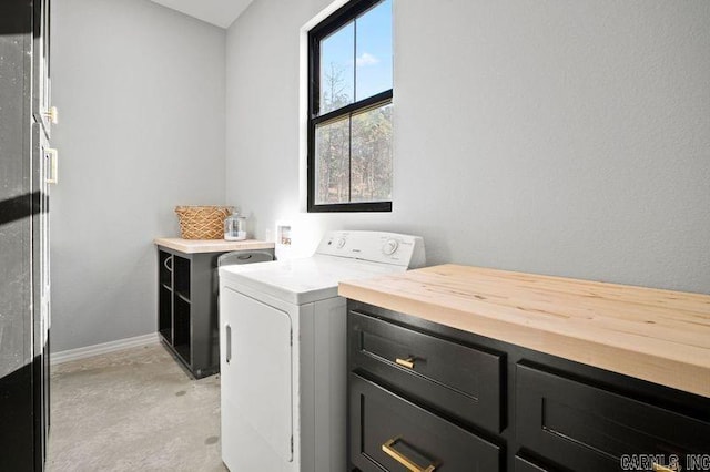 laundry room with cabinets and washer / clothes dryer