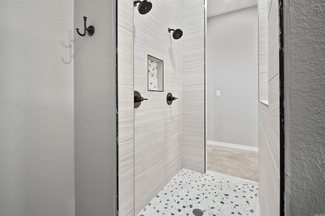 bathroom featuring a tile shower