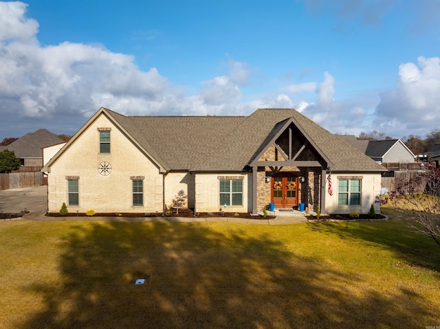 view of front of property with french doors and a front yard