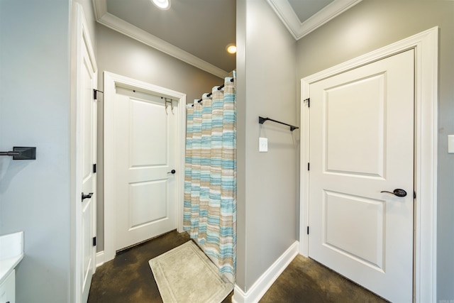 bathroom featuring concrete flooring, walk in shower, and crown molding