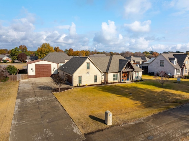 view of front of property featuring a front yard and a garage