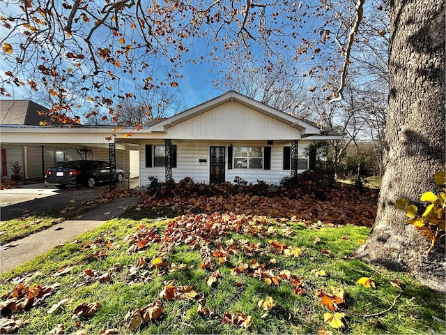 ranch-style house featuring a carport