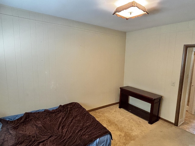 bedroom featuring light colored carpet