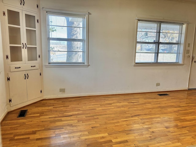 unfurnished room featuring light hardwood / wood-style flooring