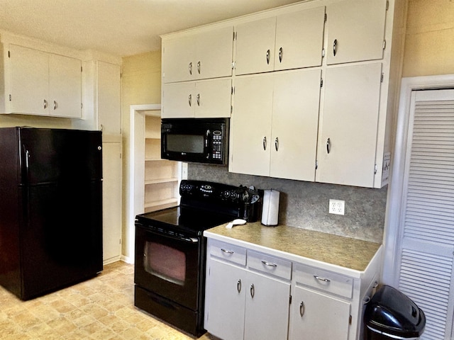 kitchen featuring backsplash, white cabinetry, and black appliances