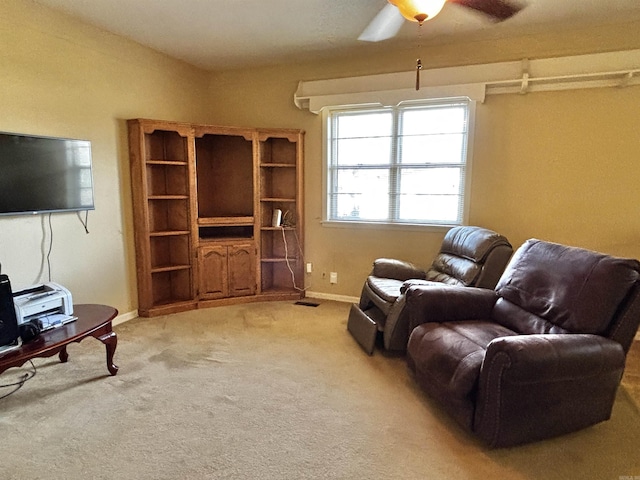 living room featuring ceiling fan and carpet floors