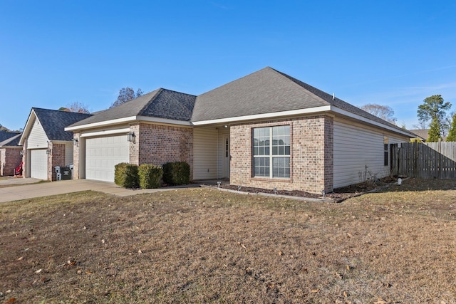 single story home with a front yard and a garage