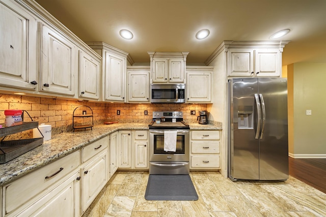 kitchen with light wood-type flooring, tasteful backsplash, light stone counters, stainless steel appliances, and crown molding