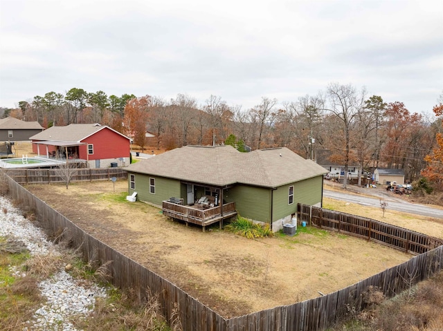 rear view of house featuring a deck