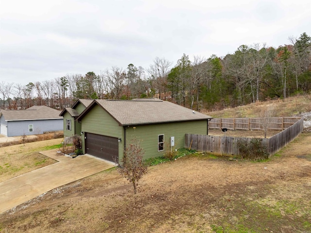 view of property exterior featuring a garage