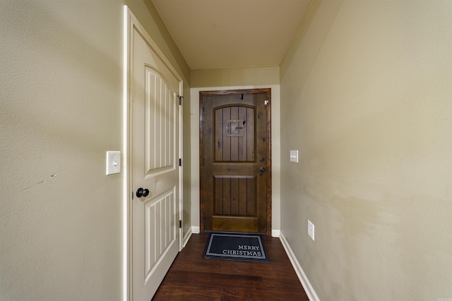 doorway with dark hardwood / wood-style flooring