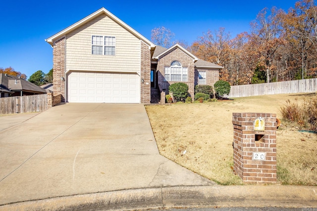 view of front property with a garage and a front yard