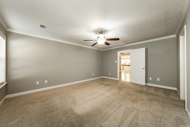 unfurnished bedroom featuring carpet, ceiling fan, and crown molding