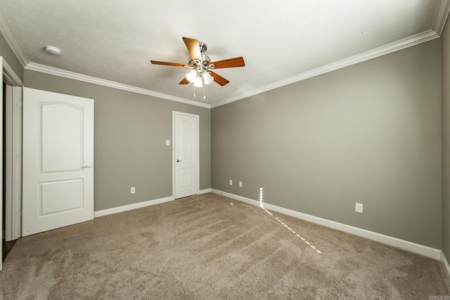 unfurnished bedroom featuring a textured ceiling, ceiling fan, carpet floors, and ornamental molding