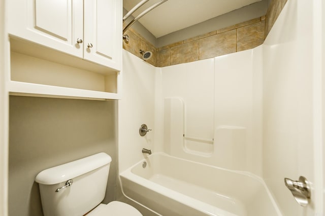 bathroom featuring shower / bathing tub combination and toilet