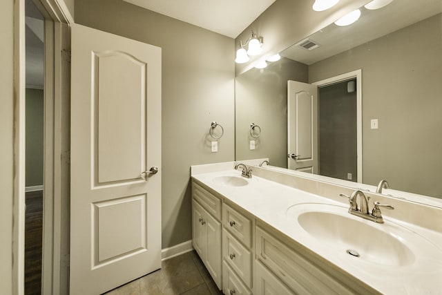 bathroom with vanity and tile patterned floors