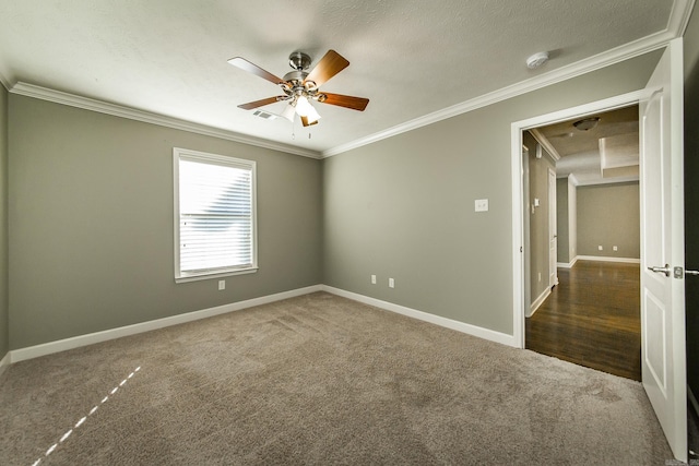 unfurnished room featuring crown molding, dark hardwood / wood-style flooring, ceiling fan, and a textured ceiling