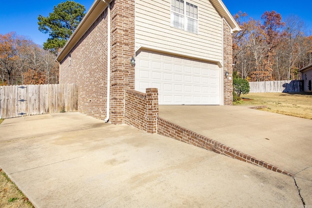 view of side of property featuring a garage