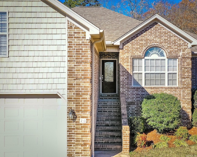 entrance to property featuring a garage