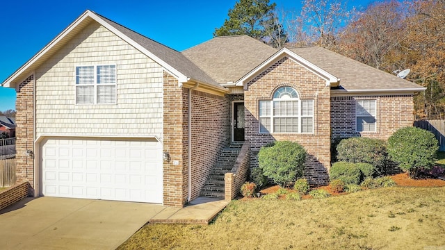 view of front property featuring a front lawn and a garage