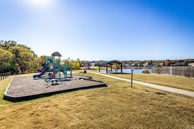 view of play area with a lawn, a gazebo, and a water view