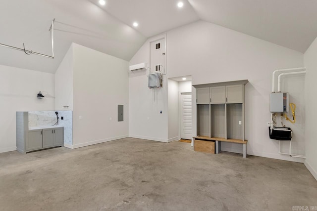 garage with electric panel, water heater, and a wall mounted air conditioner