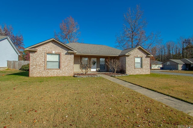 ranch-style home featuring a front yard