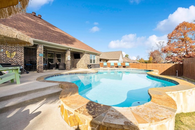 view of swimming pool featuring a patio area