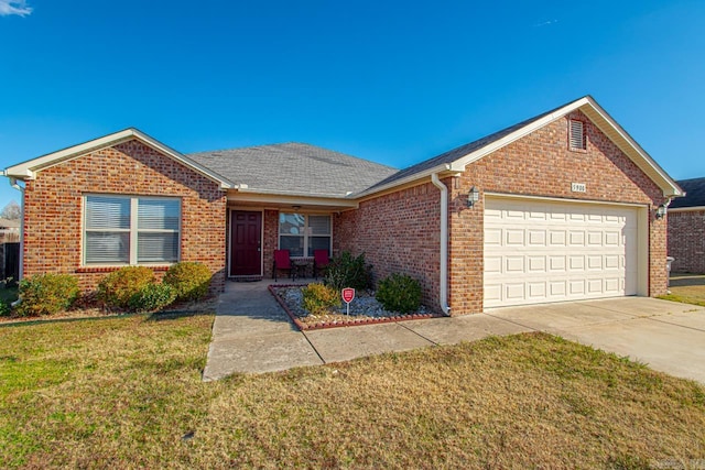 ranch-style house with brick siding, a shingled roof, concrete driveway, an attached garage, and a front yard