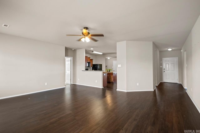 5900 Willow Way, Sherwood, AR 72117 - unfurnished living room featuring dark wood-type flooring and ceiling fan