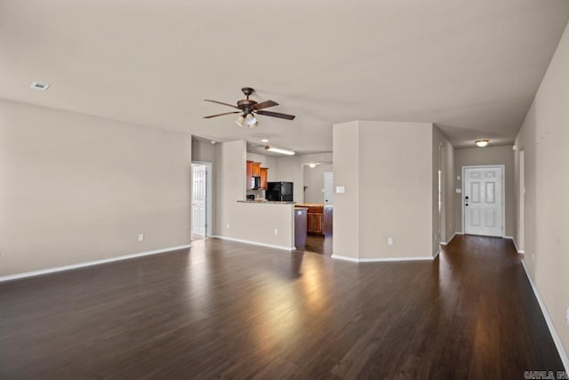 unfurnished living room with ceiling fan, visible vents, baseboards, and dark wood-style flooring