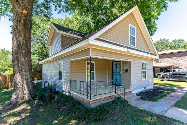 view of front of house featuring covered porch and central air condition unit