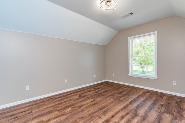 bonus room featuring dark hardwood / wood-style flooring and lofted ceiling