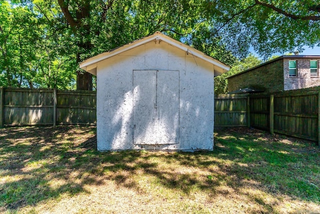 view of outbuilding with a lawn