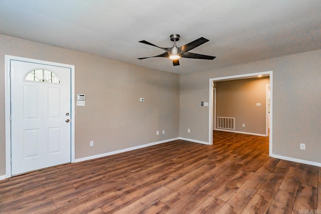 interior space featuring ceiling fan, dark hardwood / wood-style flooring, and a textured ceiling