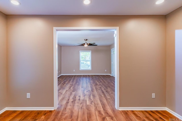 spare room featuring ceiling fan and light hardwood / wood-style floors